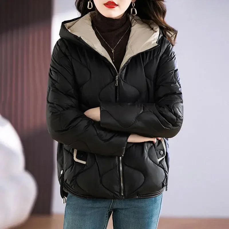 Detail shot: Women's cozy quilted puffer jacket, showing collar & insulation for fall & winter.