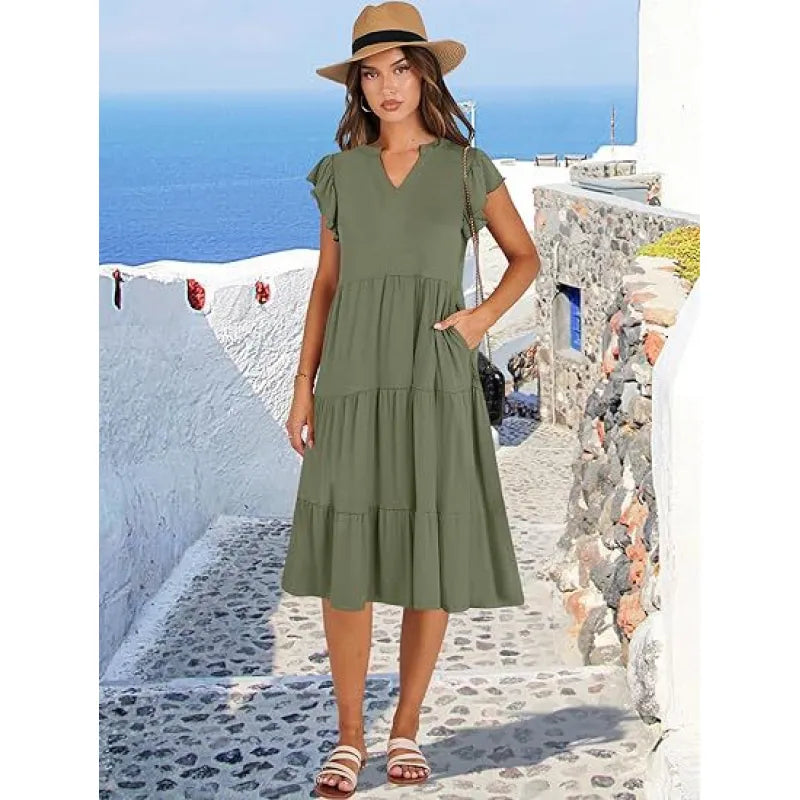 Casual women's V-neck midi dress featuring a flowing tiered skirt & elegant flutter sleeves for comfort.