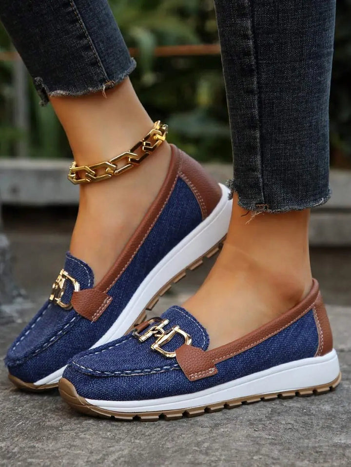 Professional woman wearing elegant orthopedic work loafers with arch support for long days.