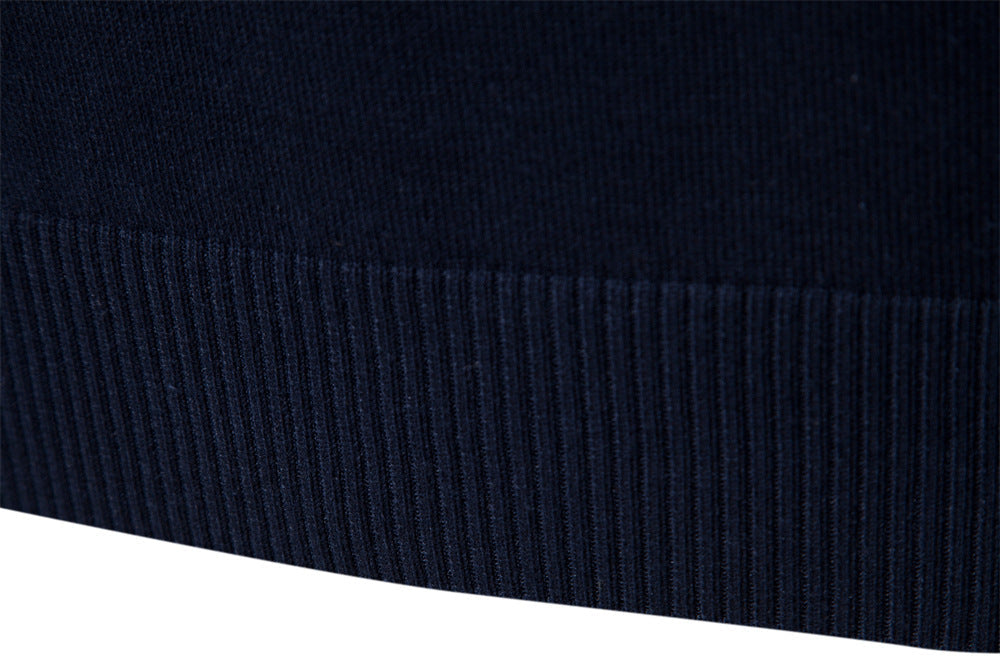 Black-blue colorblock half-zip, men's fashion sweater with stand collar, modern style.