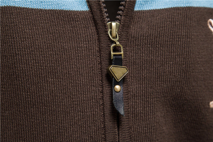Side profile of a men's zip-up colorblock sweater.
