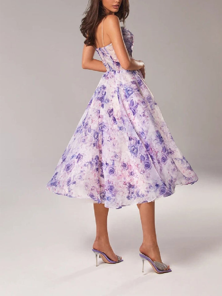 Purple A-line women's midi dress, elegant boho style with flowy fabric & spaghetti straps, perfect for summer.