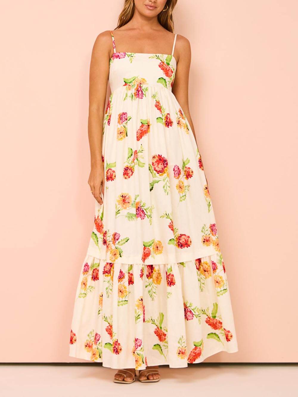 Flowy women's beige open back maxi sundress. Stylish casual summer dress for beach or elegant vacation wear.