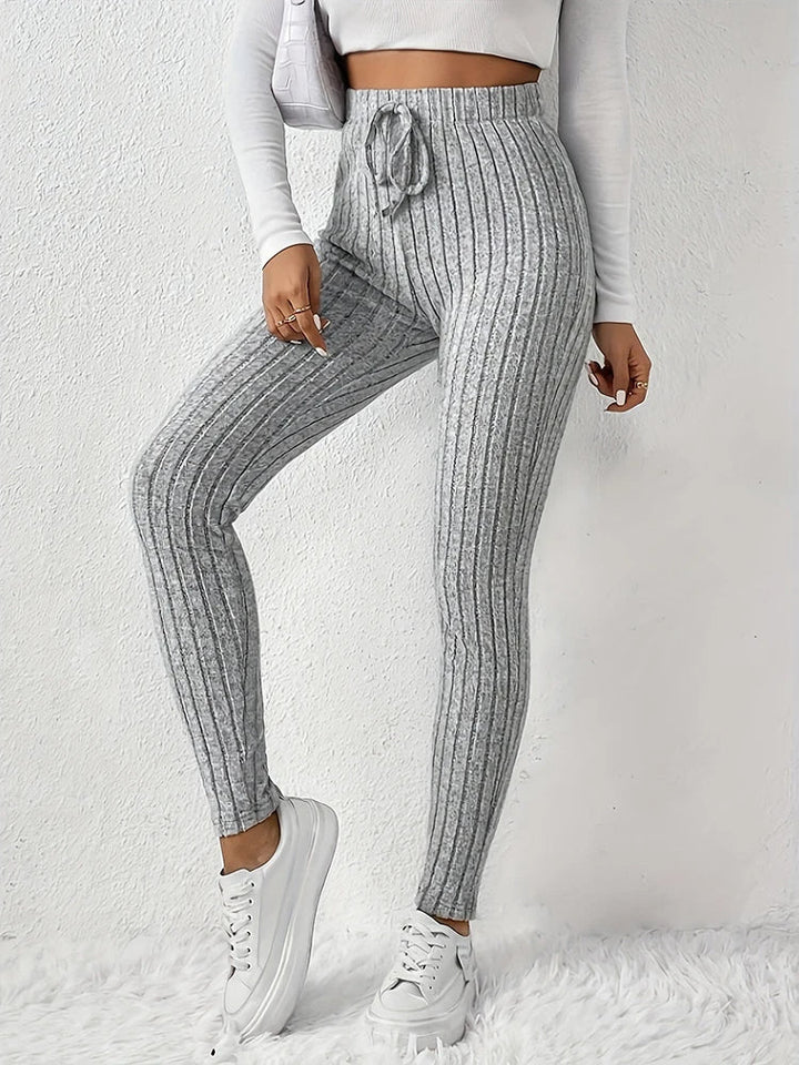 Women's high-rise ribbed leggings, slim fit, comfortable for athleisure & everyday casual wear.
