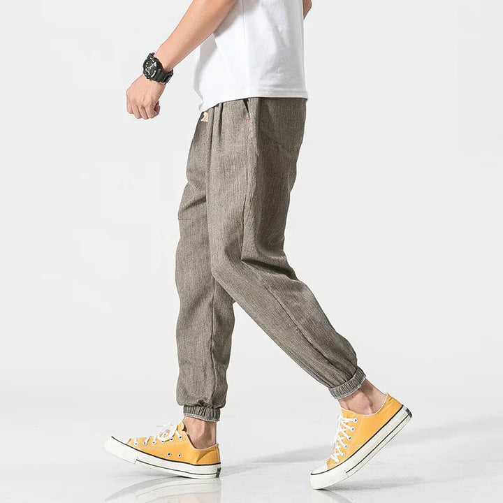 Modern men's athletic joggers with drawstring waist & tapered leg, ideal for active wear & casual comfort.