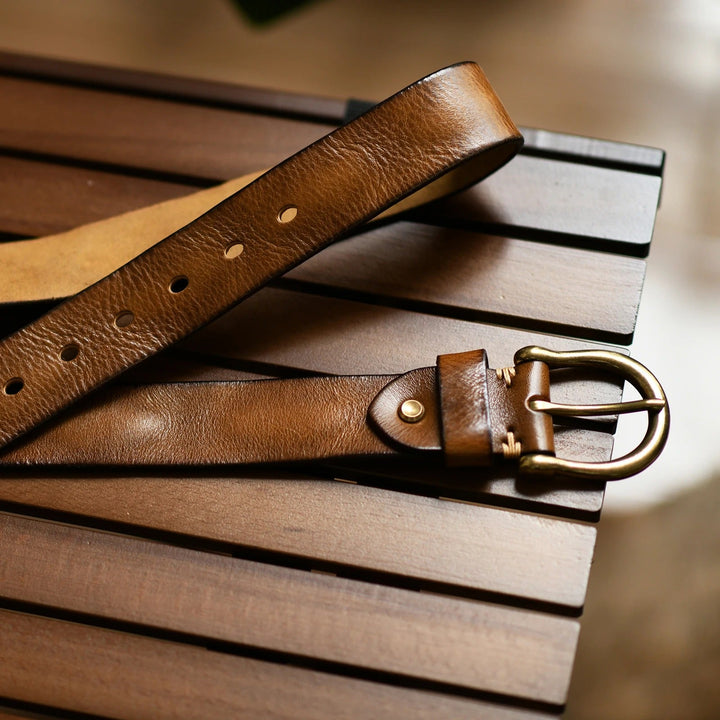 Elegant men's full-grain leather belt. Durable cowhide accessory enhancing formal and casual looks.