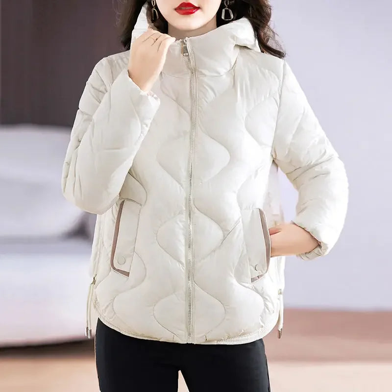 Close-up: Women's quilted puffer jacket, highlighting warm insulation and chic design for winter.