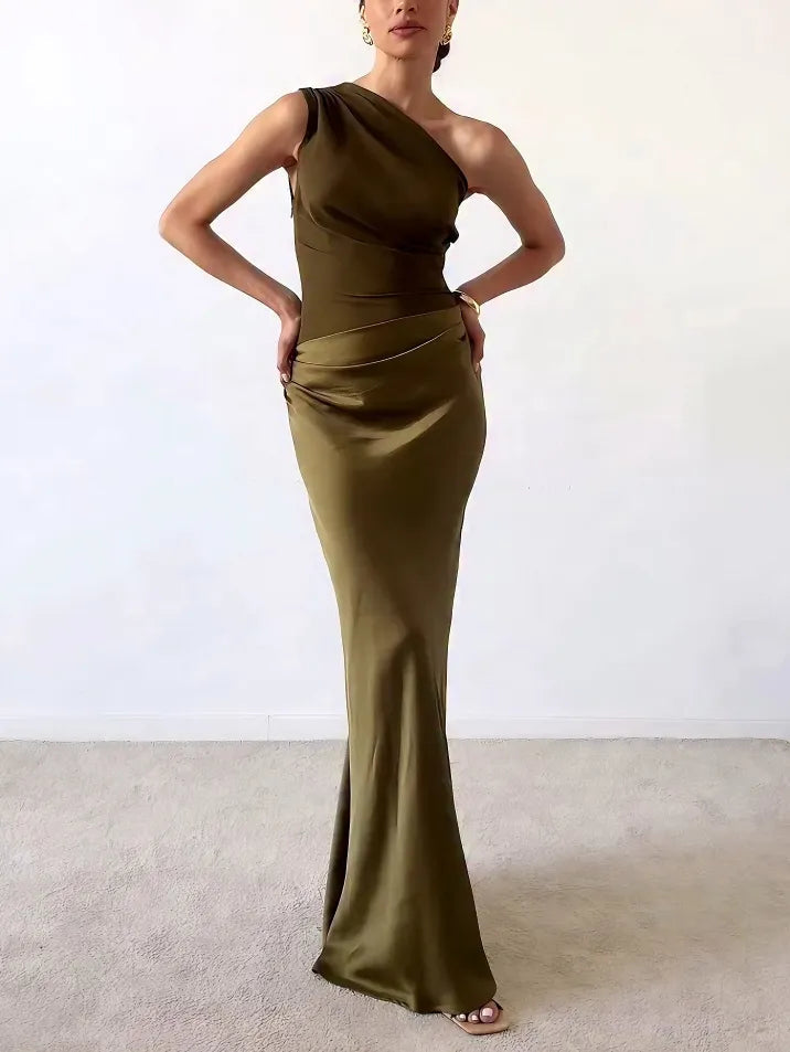 Women's formal brown wedding guest maxi dress with chic asymmetric pleats & flowing silhouette.