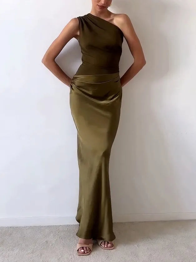 Women's formal pleated maxi dress, elegantly designed with asymmetric details for wedding guests & evening events.