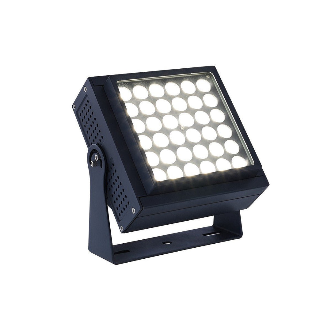 Vibrant RGB LED landscape spotlight illuminating a garden path, showcasing dynamic color options for exterior decor.