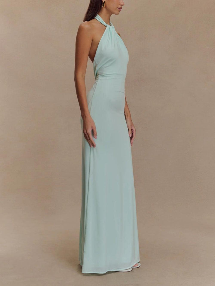 Chic women's halter neck maxi sundress with an alluring open back. Ideal for summer beach vacations.