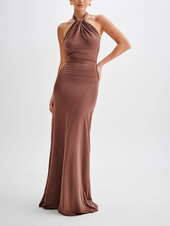 Stylish women's open-back halter maxi sundress. Perfect casual summer dress, beachwear, vacation outfit.