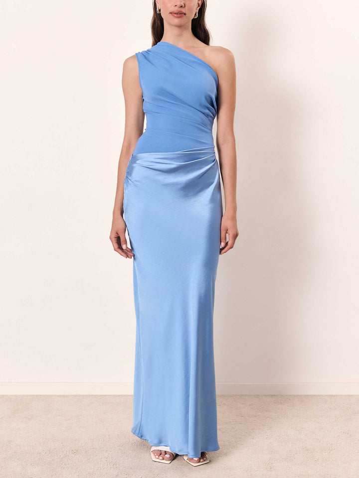 Elegant dark green wedding guest maxi dress, a pleated asymmetric design suitable for formal special occasions.