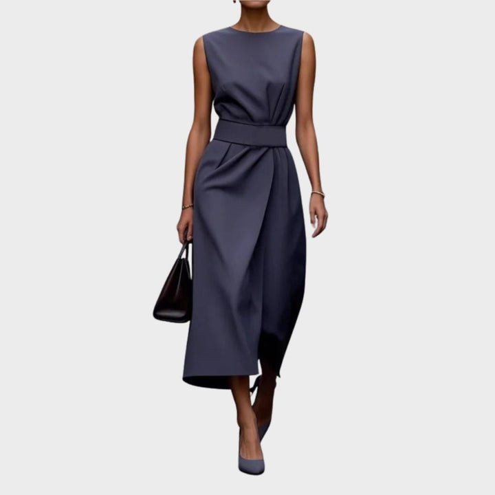Classic women's sleeveless below-knee dress. Round neck, elegant pleated waist, perfect for spring/summer fashion.