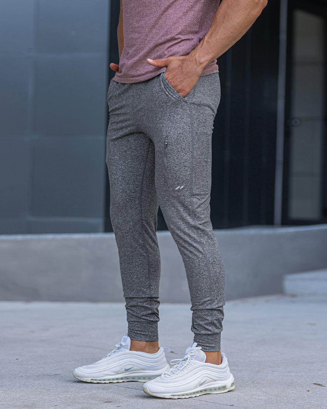 Men's tapered stretch joggers; activewear bottoms providing ultimate comfort.