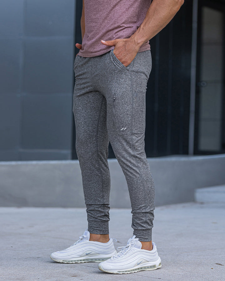 Men's tapered stretch joggers; activewear bottoms providing ultimate comfort.