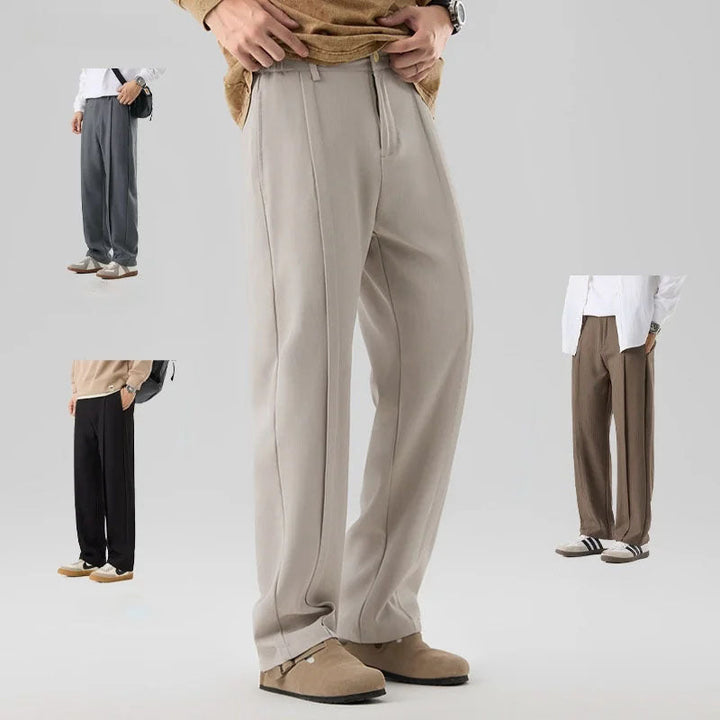 Comfortable men's drape pants with elegant pleats, offering a relaxed fit & sophisticated style.