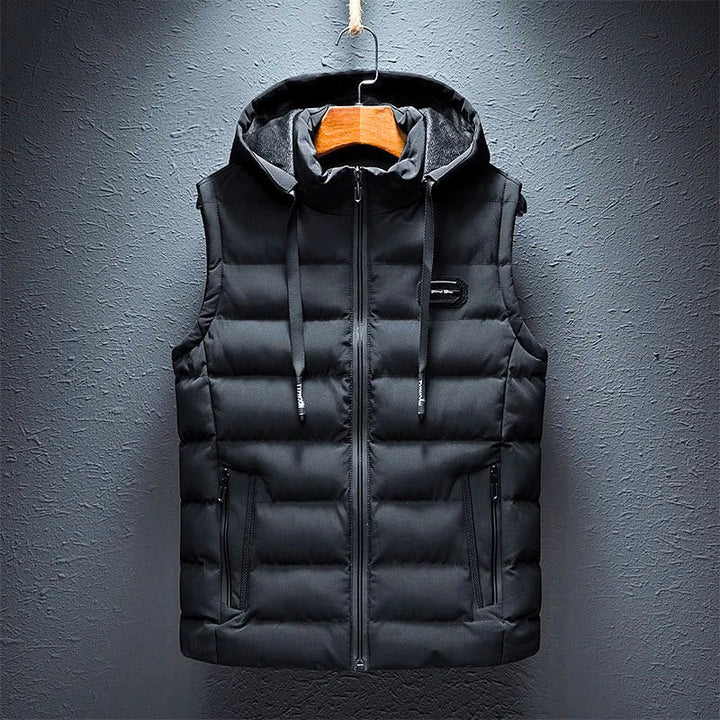 Stylish men's cotton puffer vest with hood & zippered pockets. Warm sleeveless jacket, perfect for men's casual fashion.