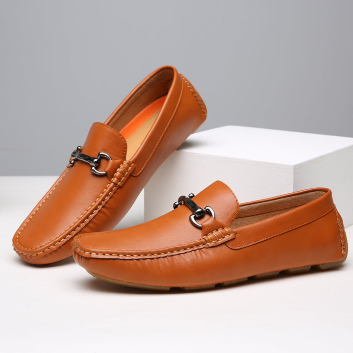 Classic men's slip-on loafers in a sleek design. Versatile dress shoes for professional, sophisticated, or smart casual outfits.