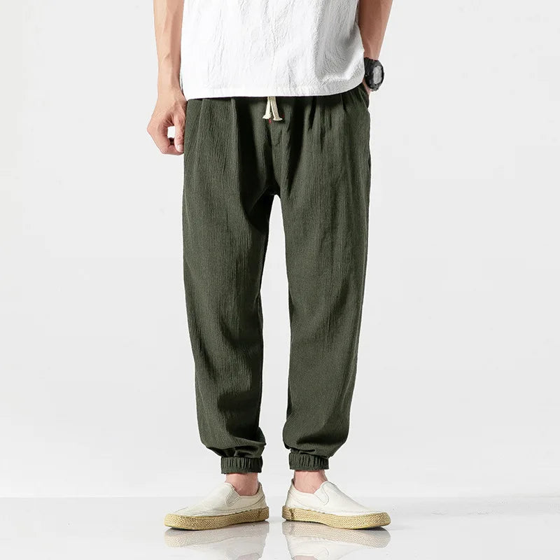 Grey relaxed fit tapered joggers for men, offering comfort & modern style for everyday wear, active or loungewear.