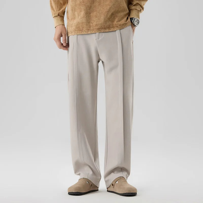 Men's pleated drape trousers for refined comfort, versatile for formal or casual wear.