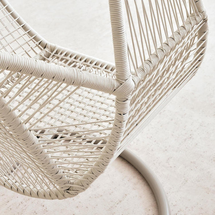 Elegant cream hanging egg chair swing for outdoor patio; features durable frame & removable cushion.
