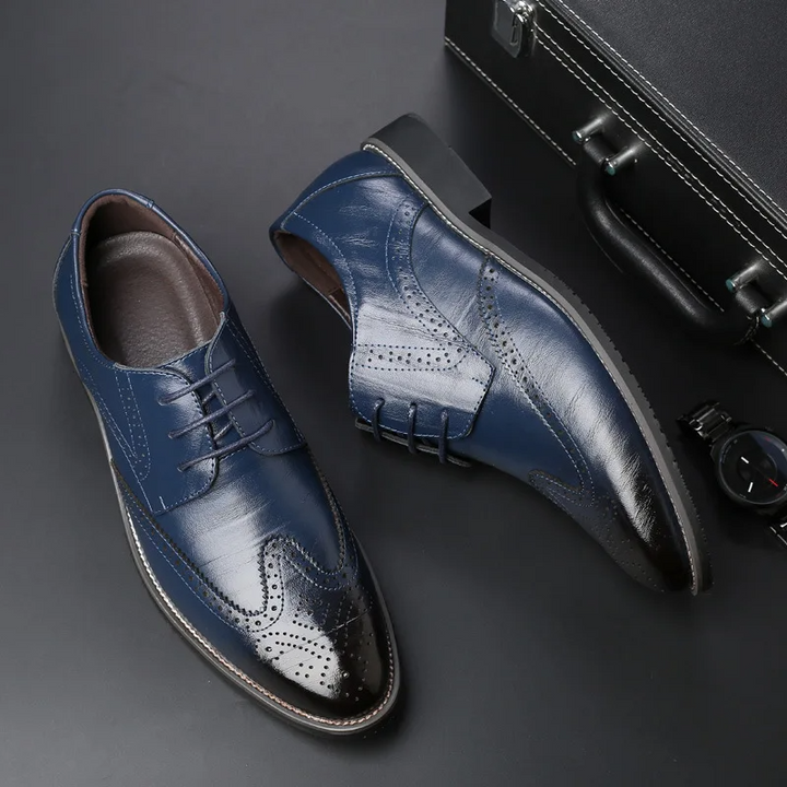 Stylish blue men's brogue oxford dress shoes, ideal for modern formal & business attire.