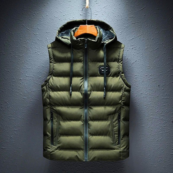 Classic men's puffer vest, hooded design. A warm & comfortable sleeveless jacket, featuring practical zippered pockets.