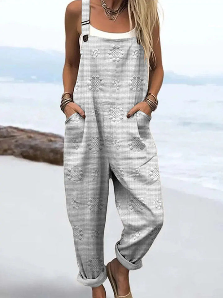 Effortless women's patterned jumpsuit featuring wide legs, adjustable fit, and pockets for stylish comfort.
