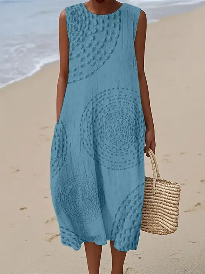 Comfortable women's sleeveless summer midi dress with beautiful floral embroidery, A-line style for casual elegance.