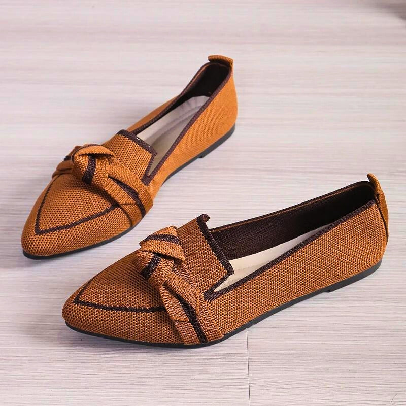 Black women's slip-on ballet flats, providing excellent arch support for elegant everyday comfort.