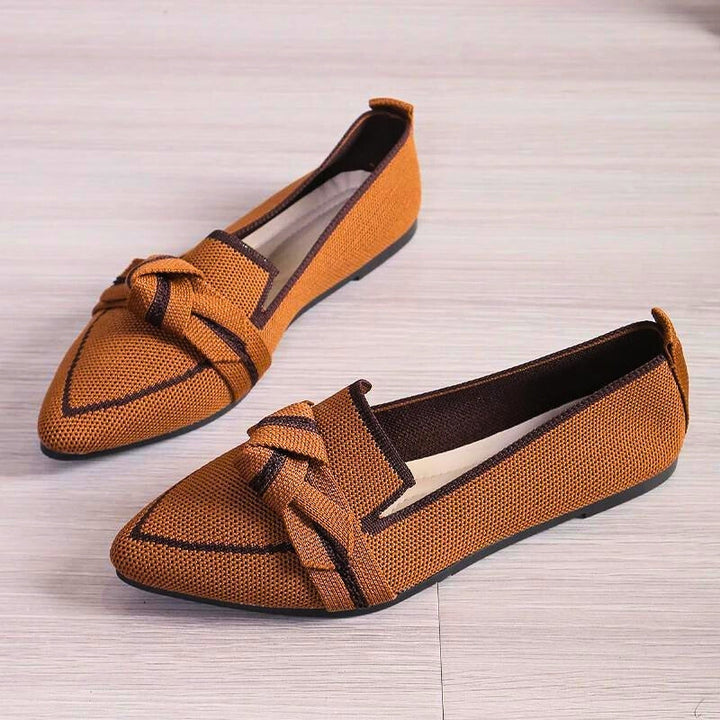 Black women's slip-on ballet flats, providing excellent arch support for elegant everyday comfort.