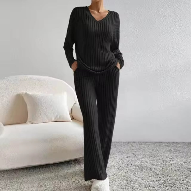 Comfortable ribbed knit trousers from a women's two-piece loungewear set. Cozy bottoms, perfect for relaxing or casual wear.