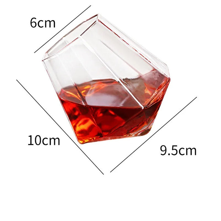 Crystal tilted whiskey tumbler, a unique spirit glass for barware. Ideal beverage drinkware & gift for whiskey enthusiasts.