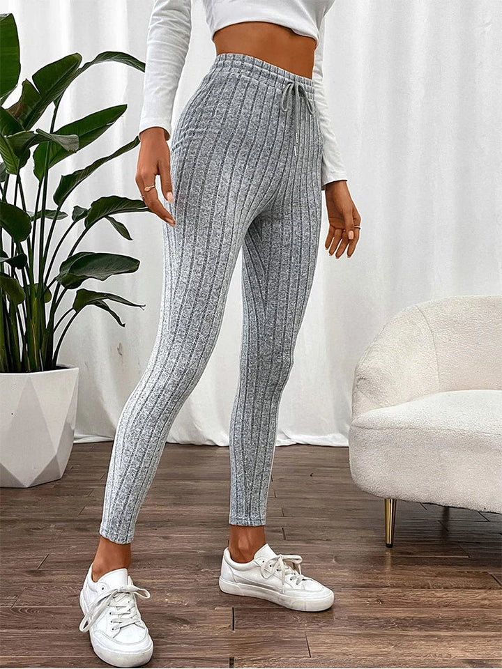 Figure-flattering high-rise ribbed women's leggings, offering comfortable slim fit & stretch for daily wear.