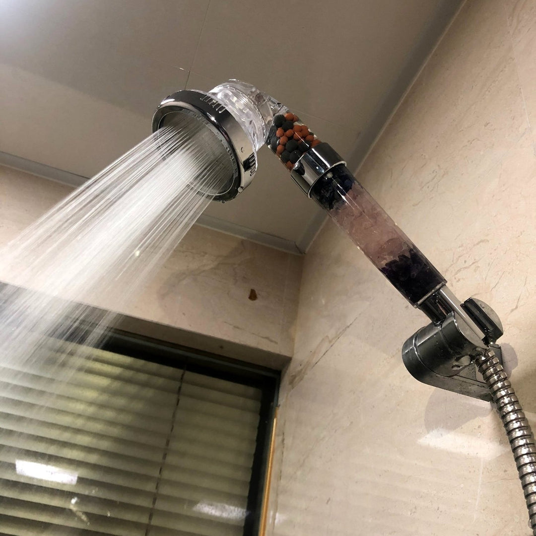 Eco-friendly high-pressure shower head with mineral filtration system, offering water saving & a luxurious bathroom upgrade.