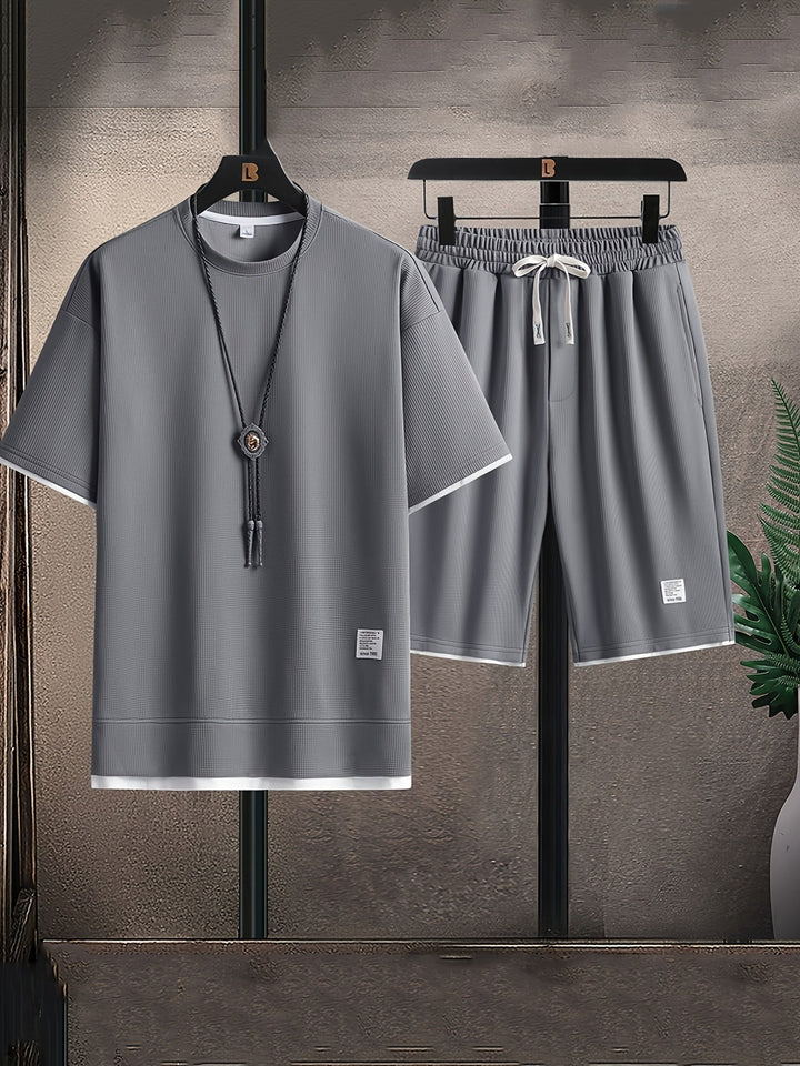 Men's relaxed fit waffle texture lounge set. Two-piece comfort shorts & t-shirt for home leisure.