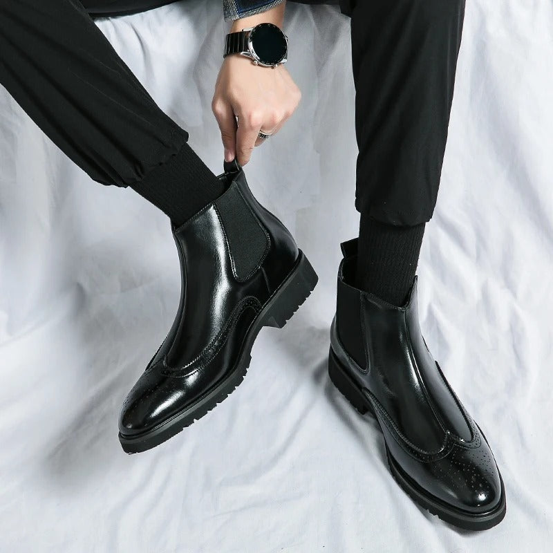 Fashionable men's slip-on chelsea boots, featuring detailed brogue, ideal for all-day wear.