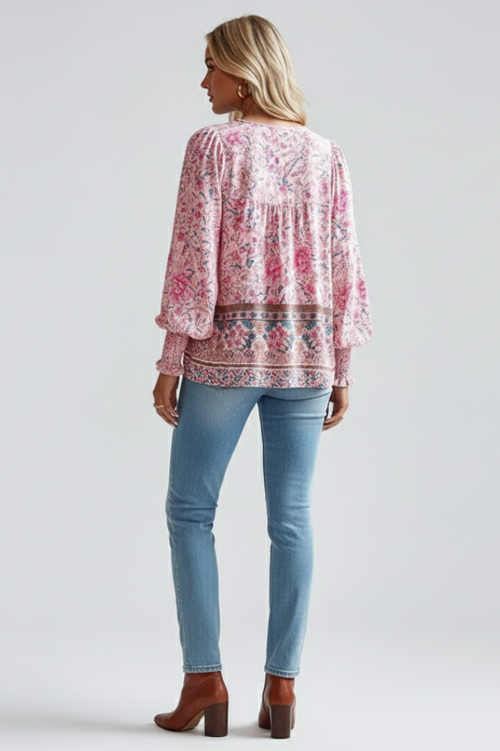Elegant V-neck women's floral blouse, loose fit long sleeve design. Effortless style for spring/summer.
