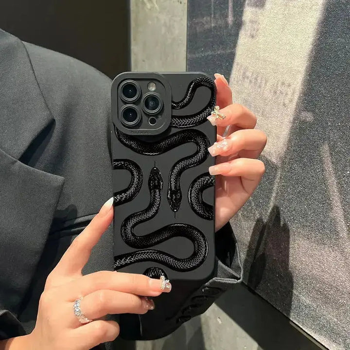 Women's protective serpent iPhone case, slim profile & wireless charging compatible.