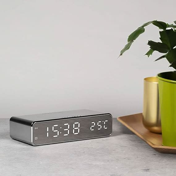 Modern gray LED digital alarm clock with phone charger, perfect bedside clock & home decor.