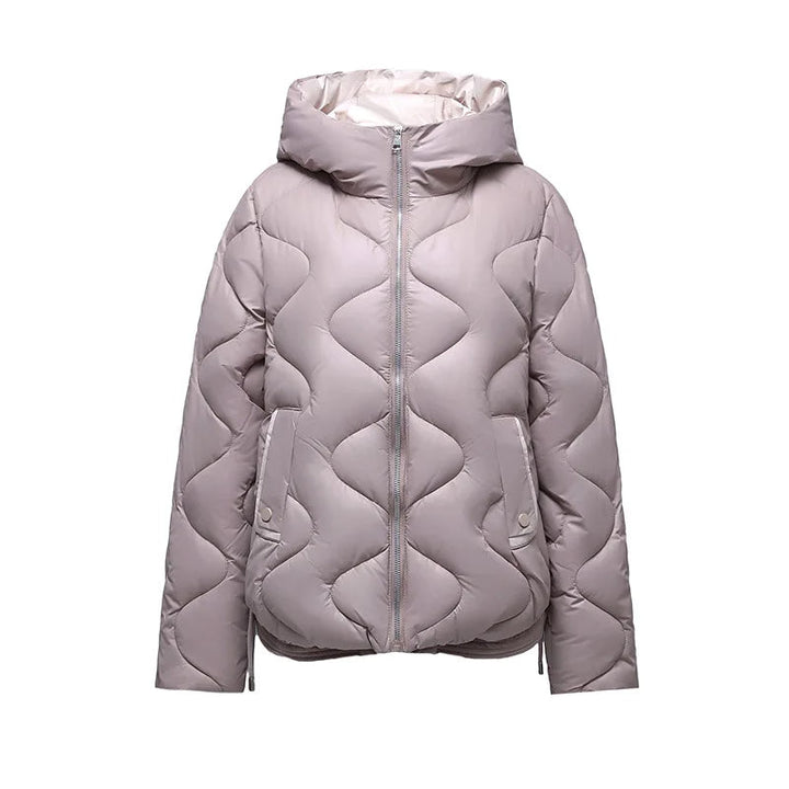Women's warm quilted puffer jacket featuring cozy insulation, perfect for stylish outerwear.