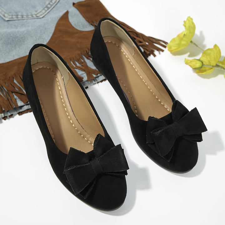Women's versatile comfort flats with arch support and a sleek design.