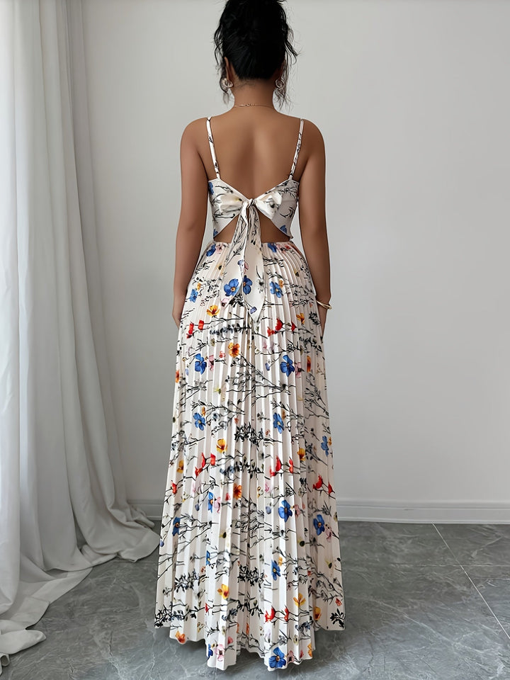 Chic women's floral maxi dress with elegant pleats, ideal for summer vacations and resort fashion.