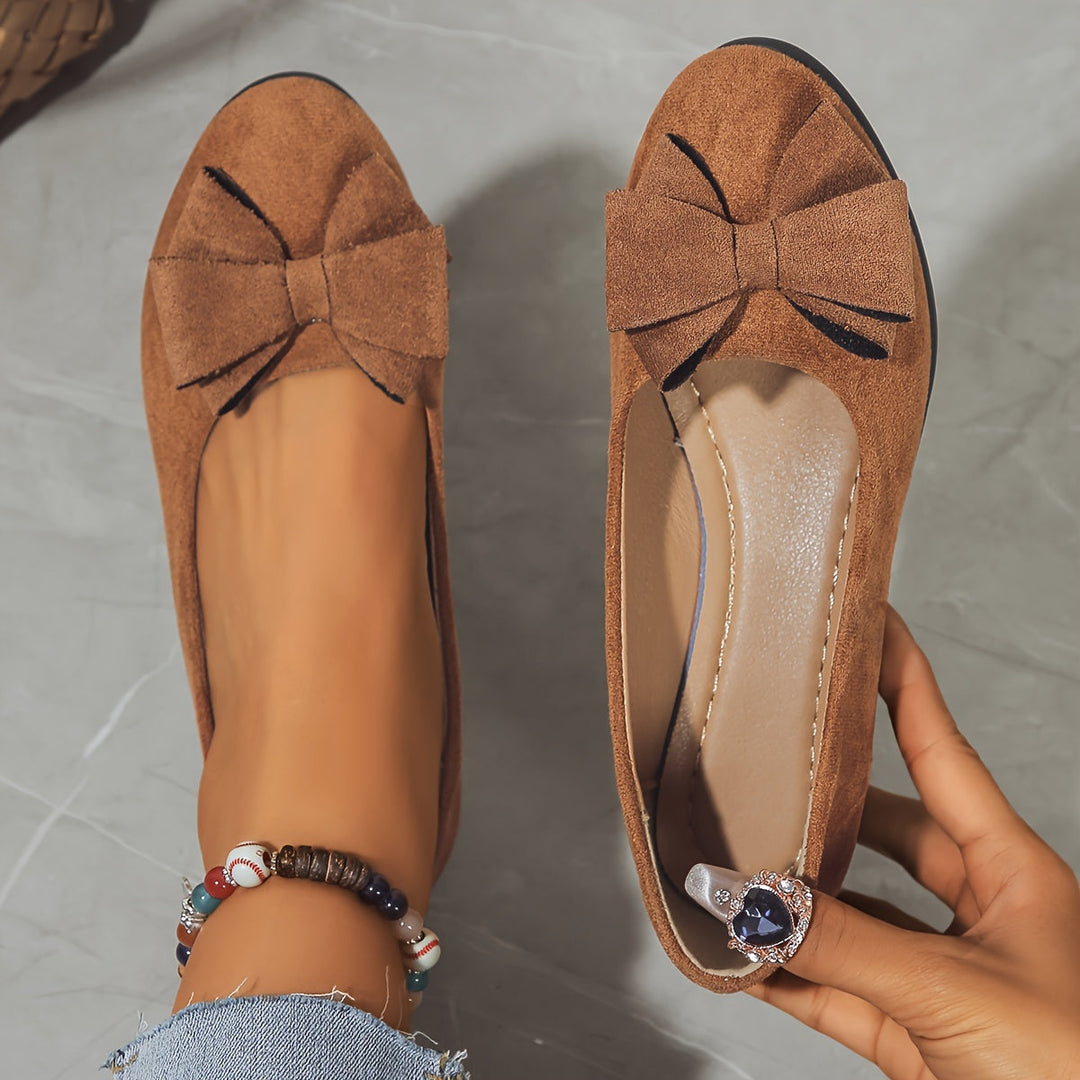 Elegant women's flat shoes with a charming bow and arch support.
