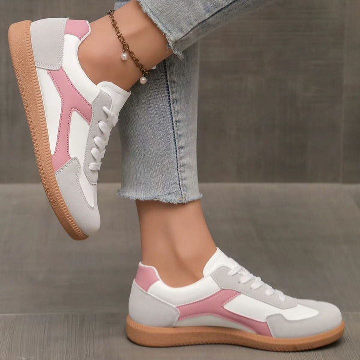 Stylish pink women's low-profile sneakers, perfect for everyday comfort, casual wear, and streetwear fashion.