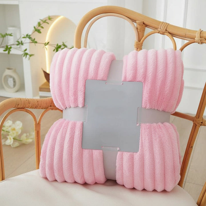 Comfortable striped flannel fleece blanket, a soft bed throw for relaxing autumn nights.