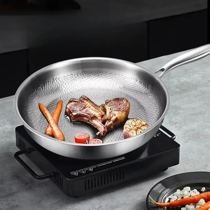 Stylish hammered titanium non-stick skillet for induction cookers. Durable, easy-clean cookware for your home kitchen.
