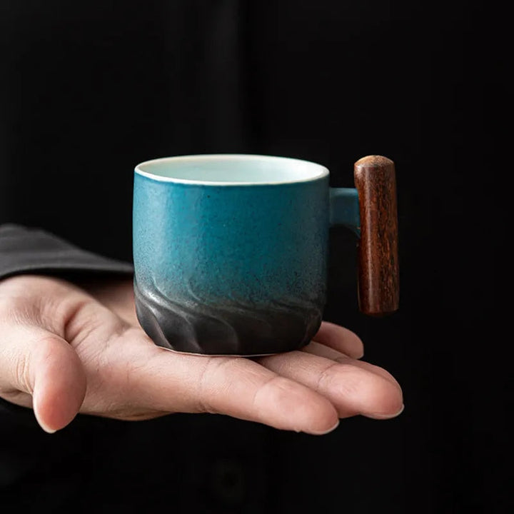 Stylish retro ceramic espresso mug, kitchenware with an elegant wooden handle.