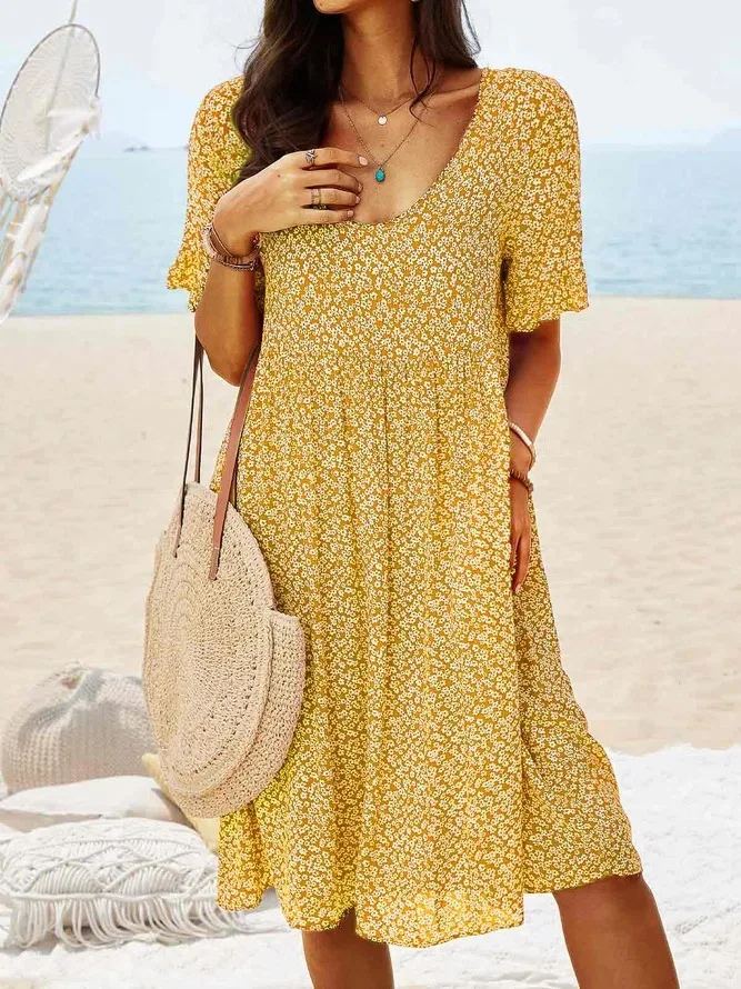 Stylish women's summer mini dress, ditsy floral pattern, flutter sleeves, round neck. Great for vacation.